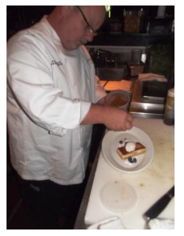 Kirk Parks, Pastry Chef, plating a dessert at Kevin Rathbun's Steak